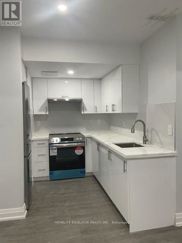 Toronto (Birchcliffe-Cliffside) apartment for rent - A kitchen with white cabinets and a blue dishwasher.