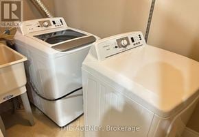 Richmond Hill (Langstaff) apartment for rent - A white washing machine and dryer are in a laundry room.