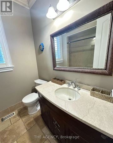 Richmond Hill (Langstaff) apartment for rent - A bathroom with a toilet, sink and mirror.