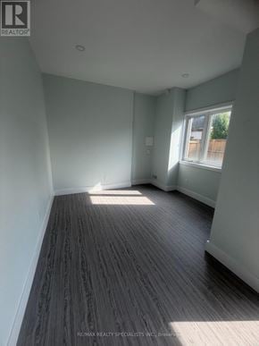 Guelph (Clairfields/Hanlon Business Park) apartment for rent - A room with wooden flooring and a window letting in sunlight.