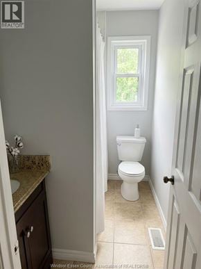 Lakeshore apartment for rent - A white toilet in a bathroom with a window.