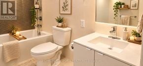 Toronto (Waterfront Communities) condo for rent - A white toilet and sink in a bathroom.