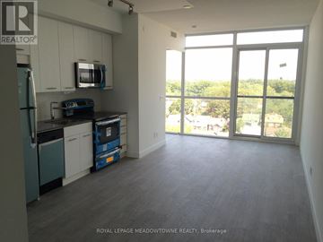 Toronto (Woodbine Corridor) condo for rent - A kitchen with a refrigerator, microwave, and dishwasher.