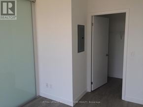 Toronto (Woodbine Corridor) condo for rent - A room with a door and a wall socket.