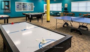 Collingwood townhouse for rent - A room with a pool table and air hockey table.