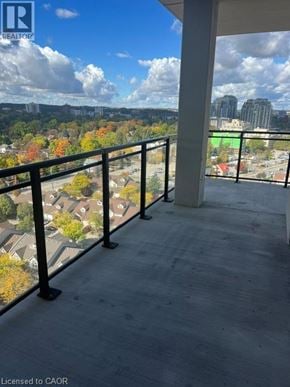 Waterloo condo for rent - A balcony with a view of a city skyline.