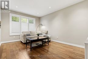 Guelph (Grange Road) apartment for rent - A living room with a couch, coffee table, and a lamp.