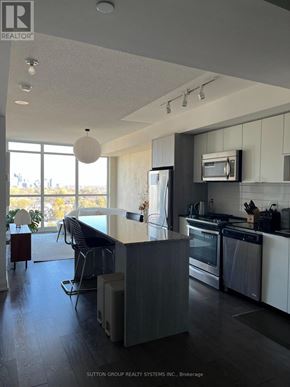 Toronto (Islington-City Centre West) condo for rent - A modern kitchen with a large island and stainless steel appliances.