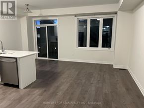 Oshawa (Donevan) townhouse for rent - A kitchen area with a sink, dishwasher, and a window.