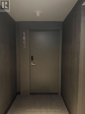 Mississauga (City Centre) condo for rent - A door with the number 5805 on it is in a hallway.