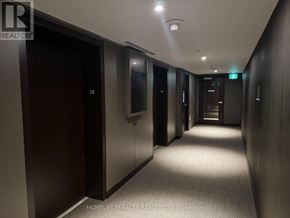Mississauga (City Centre) condo for rent - A hallway with a sign that says 58 on the door.