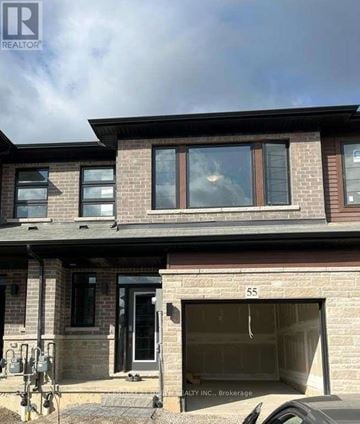 Brantford townhouse for rent - A house with the number 55 on the garage door.