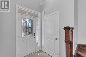 Georgina (Keswick South) apartment for rent - A white door with a glass window is open to a hallway.