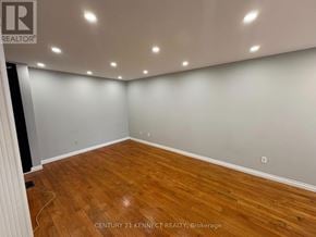 Markham (Milliken Mills West) apartment for rent - A room with wooden flooring and white walls.
