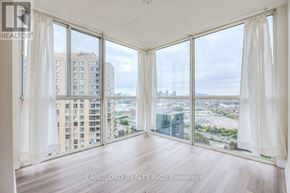 Toronto (Banbury-Don Mills) townhouse for rent - A room with a view of the cityscape through large windows.
