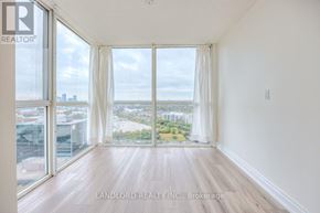 Toronto (Banbury-Don Mills) townhouse for rent - A room with a view of the city through large windows.