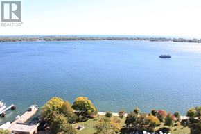 Toronto (Waterfront Communities) condo for rent - A boat is sailing on a calm blue water body.