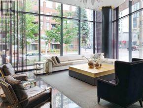 Toronto (Annex) condo for rent - A living room with a couch, chairs, and a coffee table.