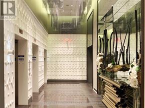 Toronto (Annex) condo for rent - A hallway with a glass wall and a white door.