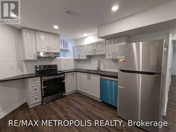 Whitby (Rolling Acres) apartment for rent - A modern kitchen with stainless steel appliances and white cabinets.