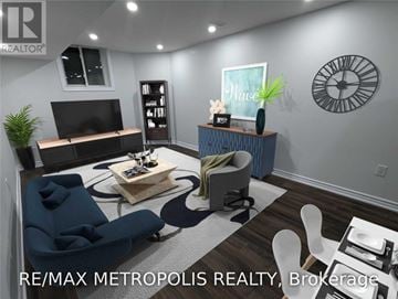 Whitby (Rolling Acres) apartment for rent - A living room with a blue sofa and a white chair.