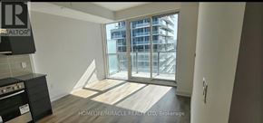 Milton (Tm Timberlea) condo for rent - A room with a large window and a stove top oven.