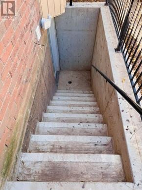 Oakville (Ga Glen Abbey) apartment for rent - A set of stairs leading down to a basement.