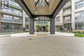 King (King City) condo for rent - A building entrance with a glass door and a sign that says RE/MAX Premier Inc. Brokerage.