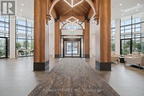 King (King City) condo for rent - A lobby with a large marble floor and wooden pillars.
