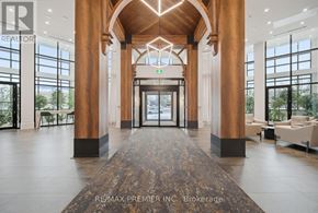 King (King City) condo for rent - A lobby with a large marble floor and wooden pillars.