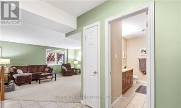 Guelph (Clairfields/Hanlon Business Park) apartment for rent - A living room with a couch and a chair.