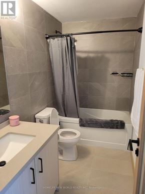 Toronto (Tam O'shanter-Sullivan) condo for rent - A bathroom with a toilet, sink, and shower.