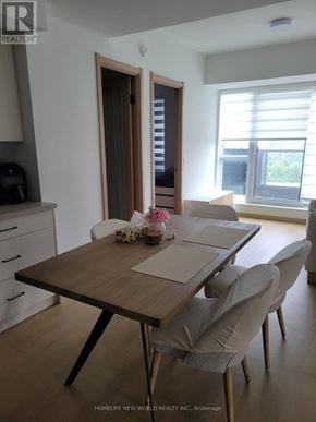 Toronto (Tam O'shanter-Sullivan) condo for rent - A dining room with a table set for four.