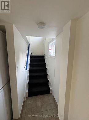 Newmarket (Bristol-London) apartment for rent - A hallway with a staircase leading to a second floor.