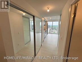 Toronto (Islington-City Centre West) condo for rent - A hallway with a glass door leading to a balcony.