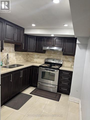 Brampton (Fletcher's West) apartment for rent - A kitchen with dark wood cabinets and a stainless steel oven.