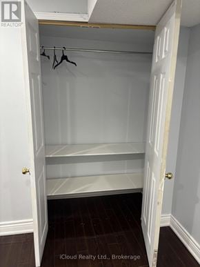 Brampton (Fletcher's West) apartment for rent - A white closet with a coat hanger and a door.