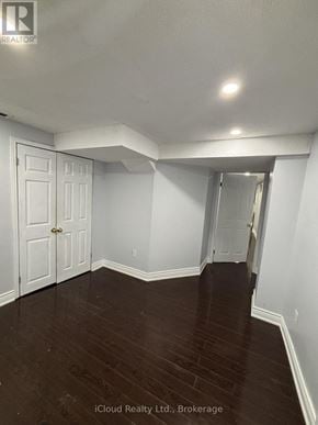 Brampton (Fletcher's West) apartment for rent - A room with white walls and dark wood flooring.