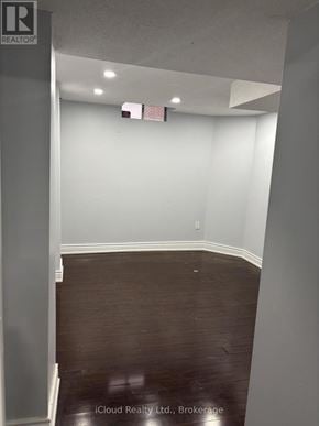 Brampton (Fletcher's West) apartment for rent - A room with a wooden floor and white walls.