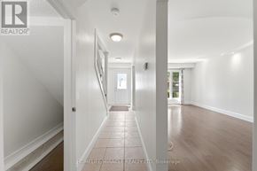 Hamilton (Gourley) apartment for rent - A living room with a fireplace and a staircase.