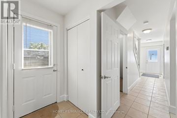 Hamilton (Gourley) apartment for rent - A kitchen with wooden cabinets and a white oven.