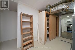 Brampton (Brampton North) apartment for rent - A room with a ladder and a doorway leading to another room.