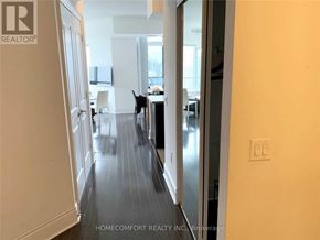 Toronto (Willowdale East) condo for rent - A black dog is sitting on a kitchen floor.