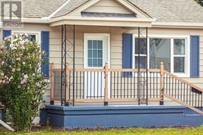 St. Catharines (Facer) apartment for rent - A house with a porch and a sign that says REALTOR.