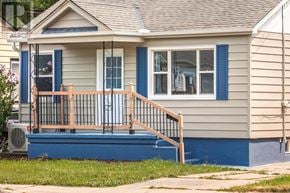 St. Catharines (Facer) apartment for rent - A small house with a blue front porch.