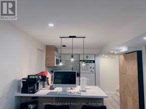 Newmarket (Bristol-London) apartment for rent - A modern home office with a desk, computer, and hanging lights.