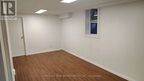 Mississauga (Central Erin Mills) apartment for rent - A room with wooden flooring and a window with blinds.