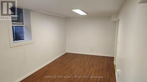 Mississauga (Central Erin Mills) apartment for rent - A room with wooden flooring and white walls, with a window on the left side.