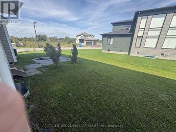 Ottawa townhouse for rent - A well-maintained lawn in front of a modern house.