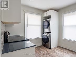 St. Catharines (E. Chester) apartment for rent - A modern kitchen with a stainless steel dishwasher and a glass top counter.